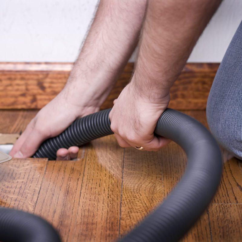 STOCK IMAGE: Service man cleaning out the air duct in a home. (iStock)