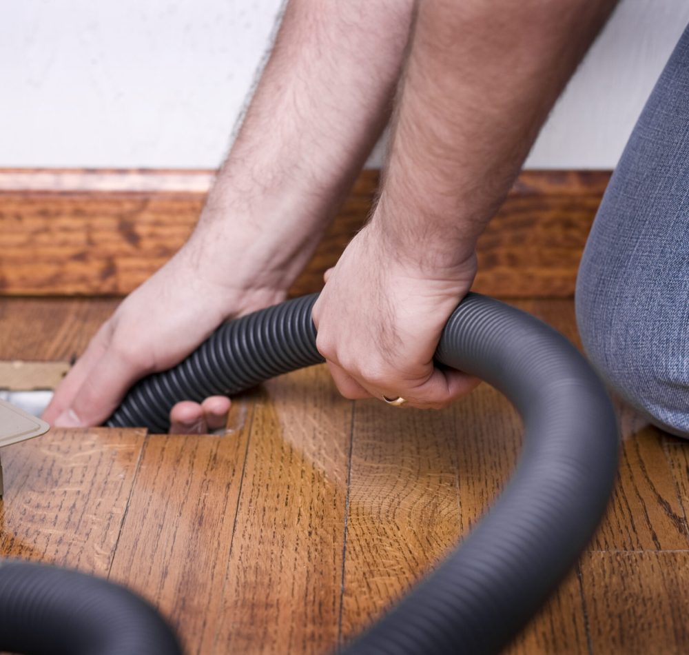 STOCK IMAGE: Service man cleaning out the air duct in a home. (iStock)