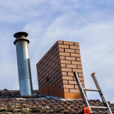 low-angle-view-chimney-ladder-roof-against-sky_1048944-14680068